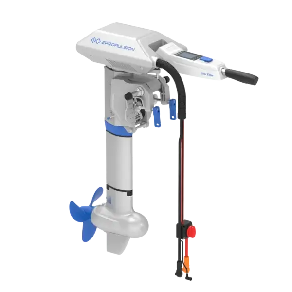 The Navy 6.0 Evo electric outboard motor, featuring a sleek white and blue design, has intuitive control handles at the top and a propeller at the bottom. Its "Eco Tiller" attachment improves maneuverability and efficiency on the water. Oceans EV