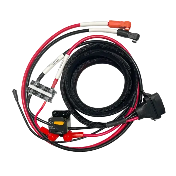A coiled set of black and red cables with connectors, a fuse holder, circuit breaker, and plug—ideal for use with the Spirit 2 E-Series Battery Adapter—arranged neatly on a white background. Oceans EV