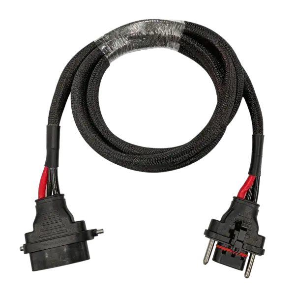 The Spirit 2 Battery Extension Cable is a black braided cord with a European two-prong plug and a rectangular power connector, coiled neatly with plastic wrap, made for use with Spirit 2 battery devices. Oceans EV